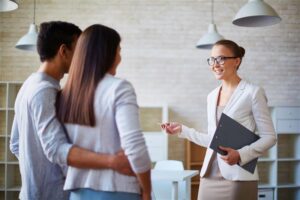 Realtor working with two clients buying a home