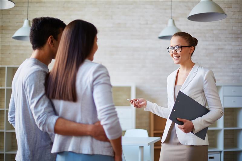 Realtor working with two clients buying a home