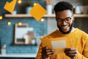 Man looking at letter for mortgage pre-approval